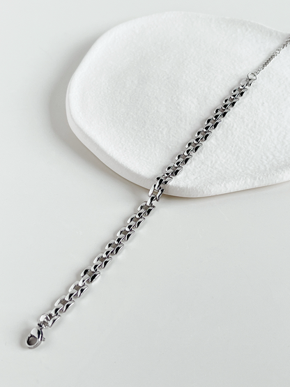 Top view of the Silver Evie lightweight watchband chains laid flat on a neutral background to display the slender, uniform width.