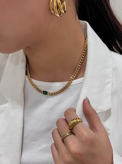 Lifestyle profile showcasing daily stackable gold curb chain link fluid drape