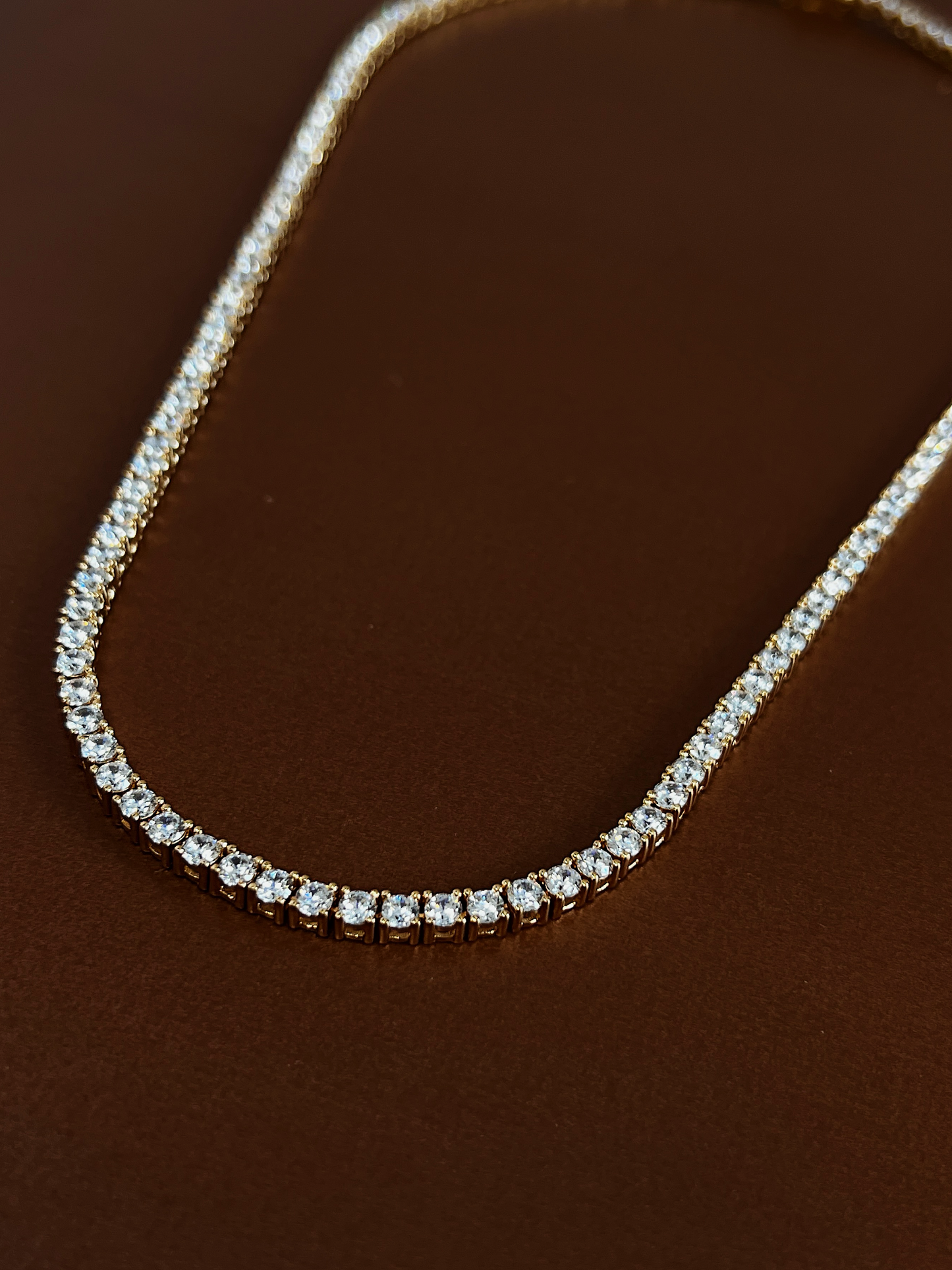 Round cut high clarity 5A cubic zirconia stones hand set in a golden foundation