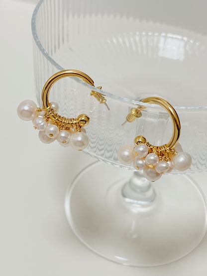 Close structural view of the Freya luxury cluster pearl earrings showing the refined wire wrapping that secures each authentic freshwater gem to the hoop.