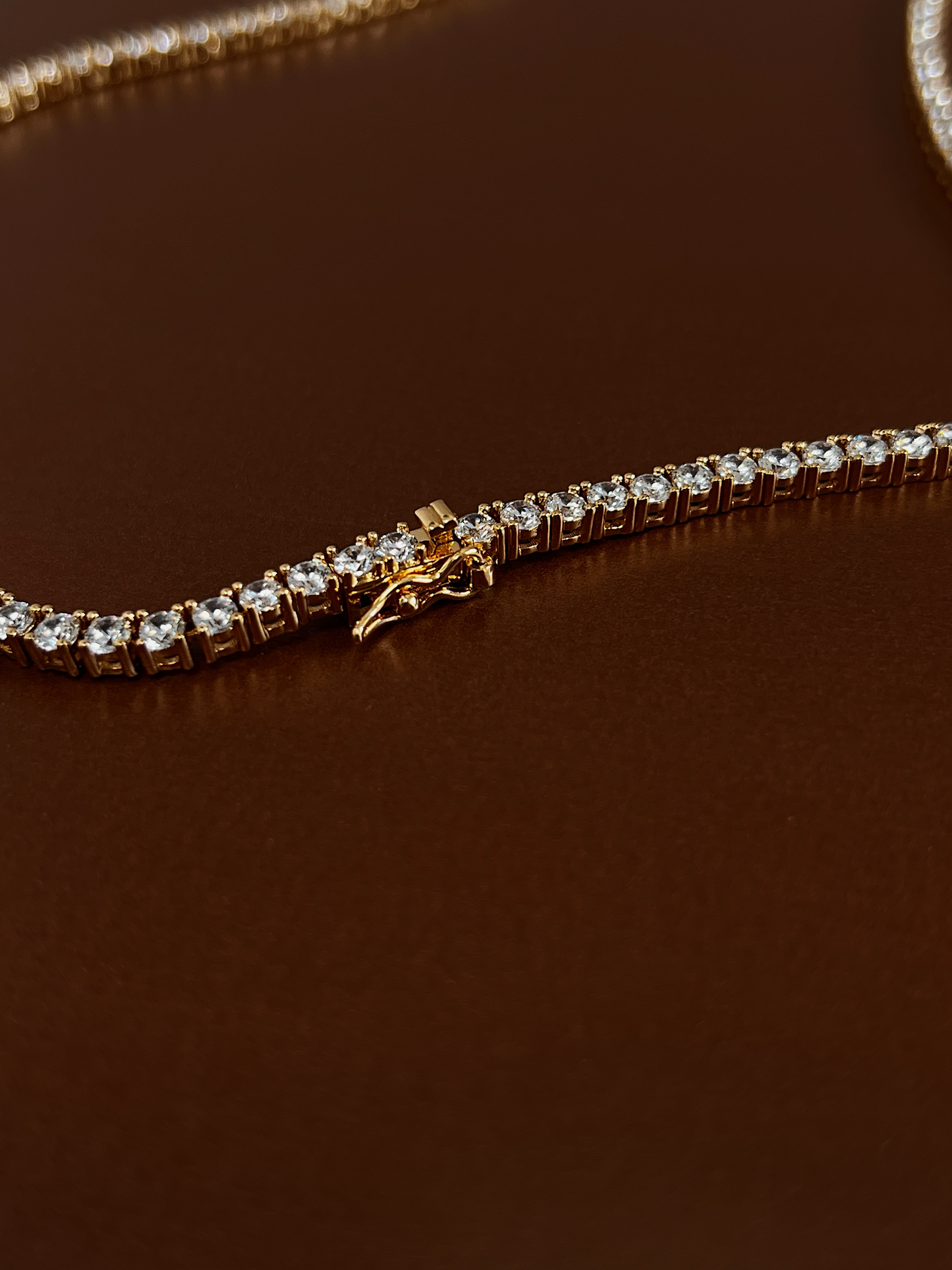 Marco shot of the hypoallergenic brass core daily statement crystal piece under soft studio light