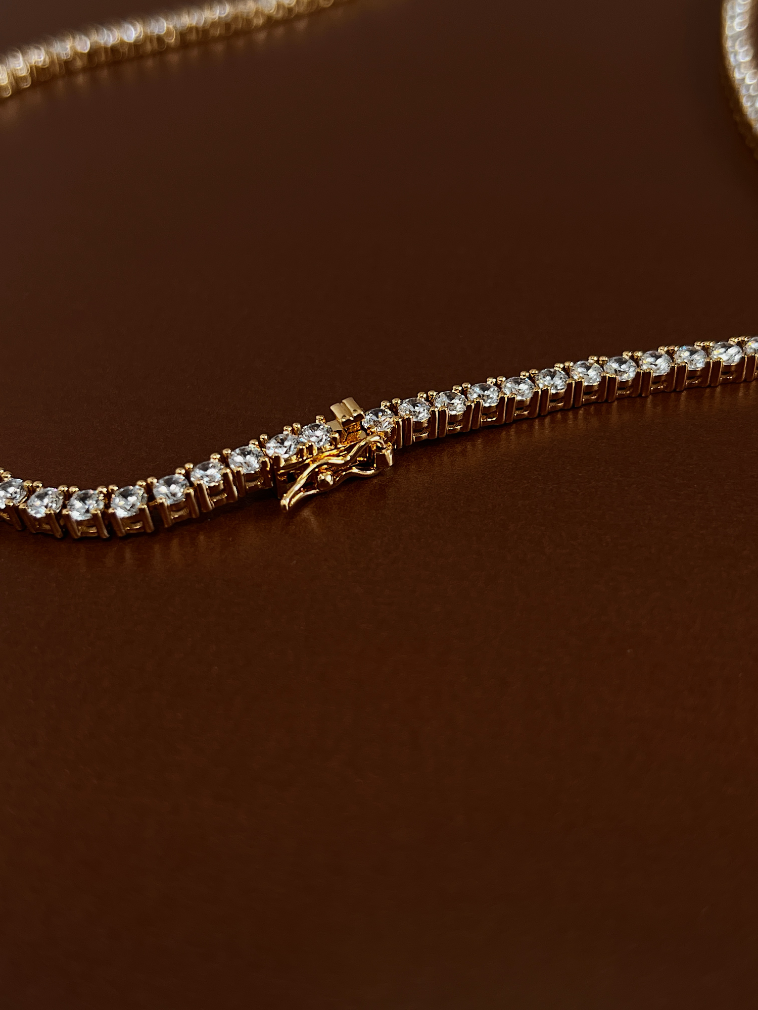 Marco shot of the hypoallergenic brass core daily statement crystal piece under soft studio light