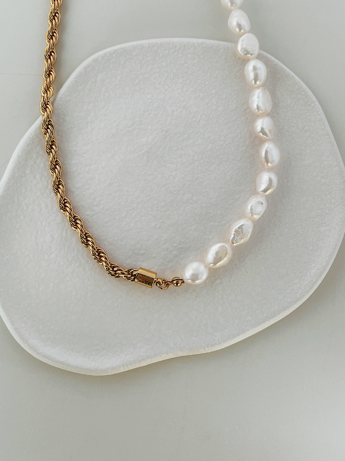 Close up of 18k gold PVD water resistant French rope twist chain texture