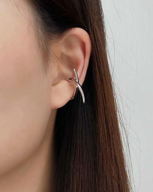 Model wearing the Harley Geometric Cuff on the mid-cartilage for an edgy, minimal look.