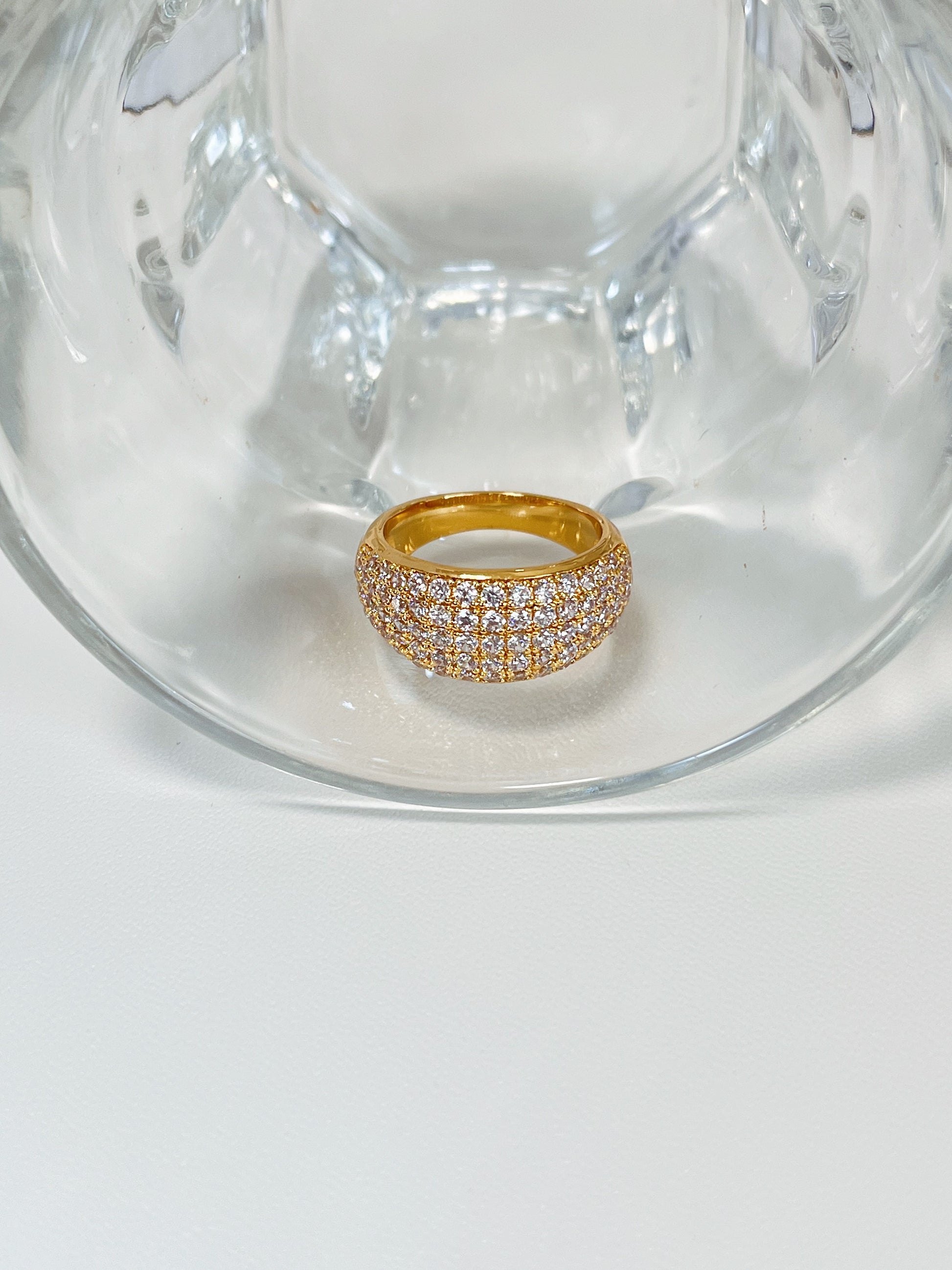 Close up of precision set cubic zirconia on gold eternity band
