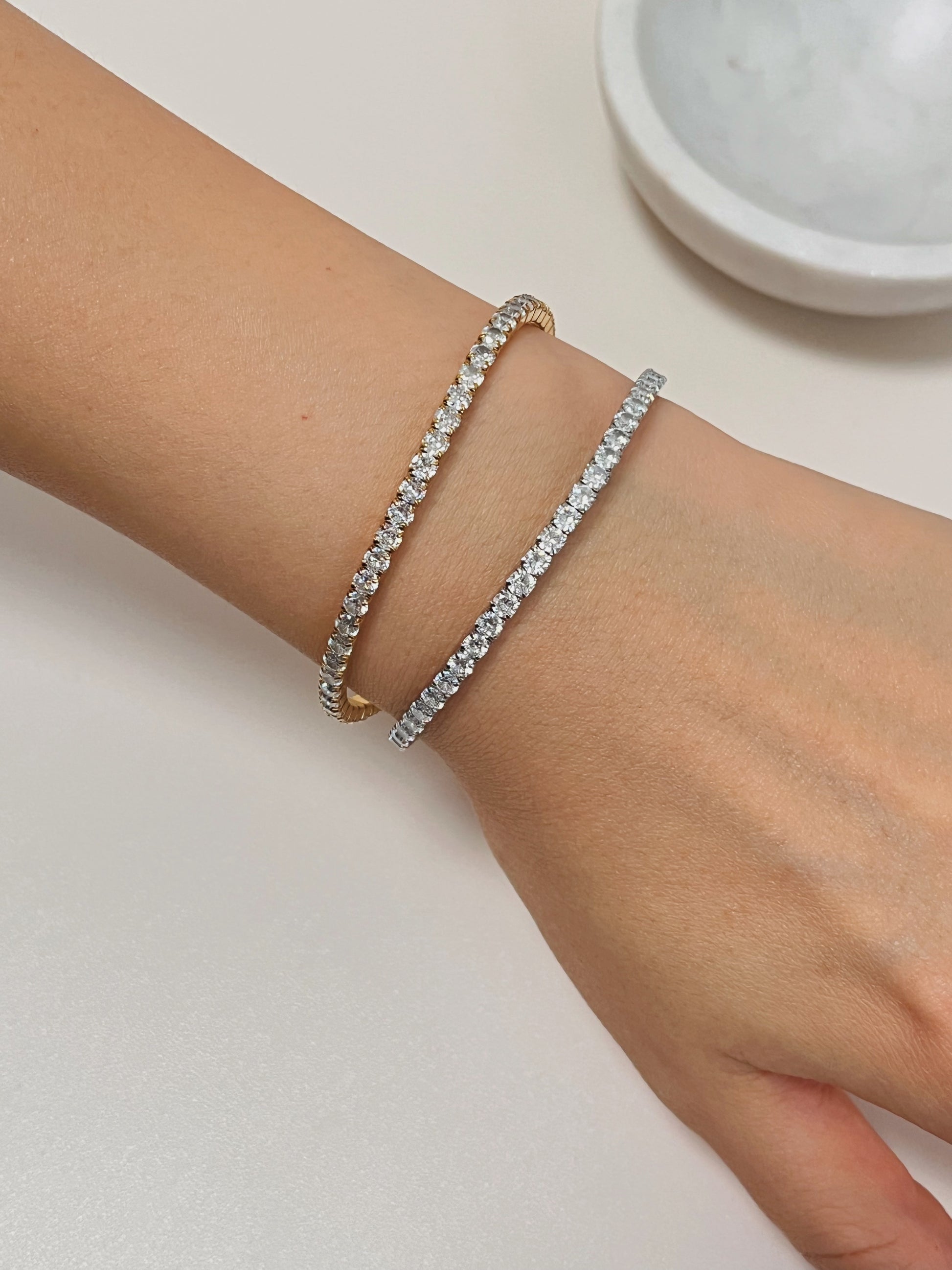Styling inspiration showing an elegant wrist stack featuring a set of 3mm Elastic Tennis Bracelet.