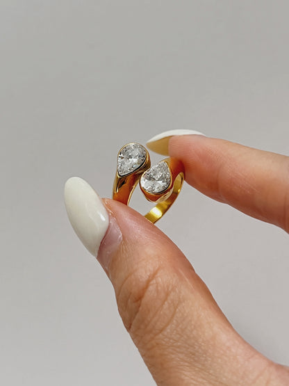 Top view of the fluid bypass band and teardrop cuts on the gold statement ring