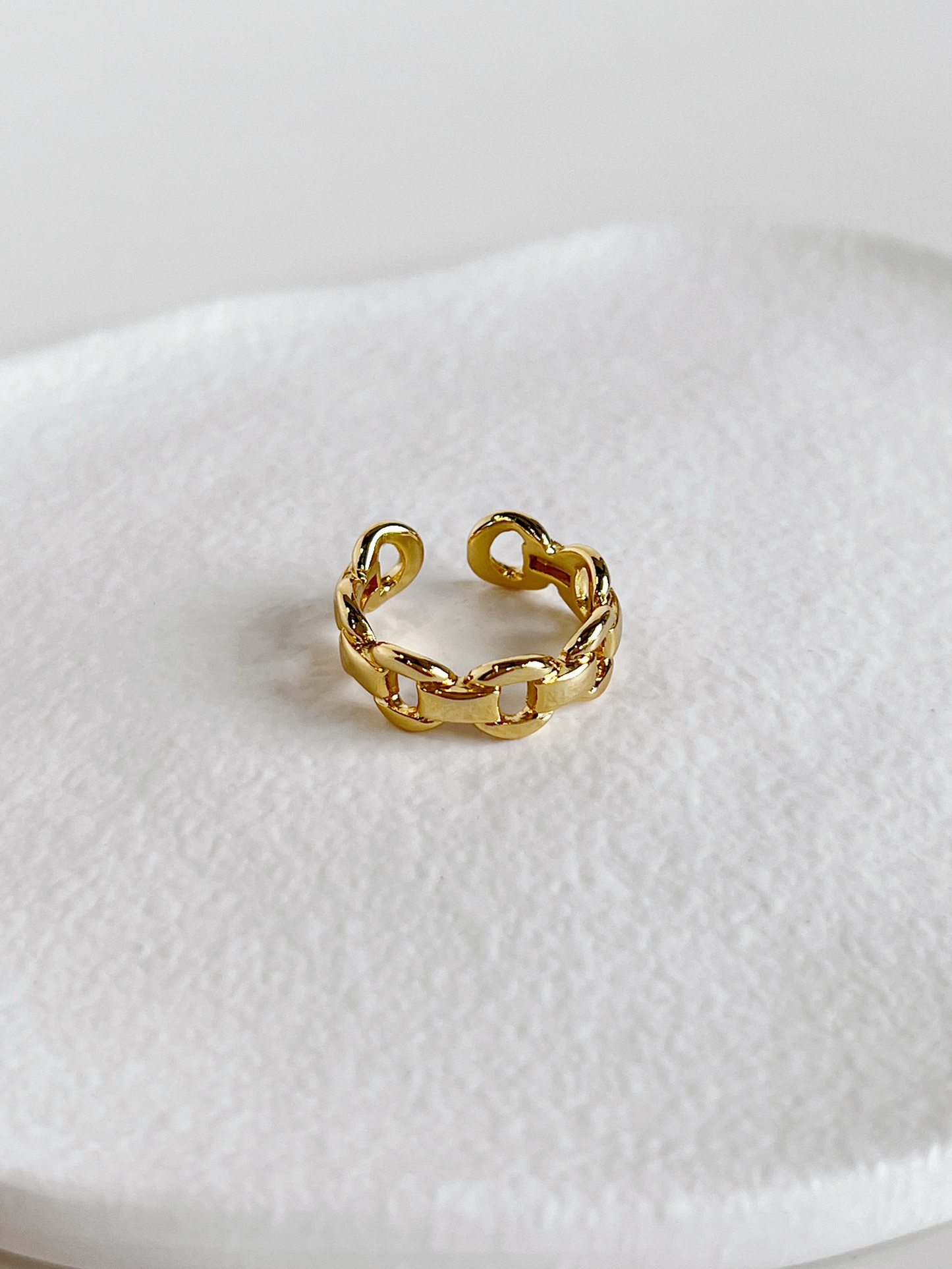 Chunky gold chain rings for women highlighting the adjustable open back