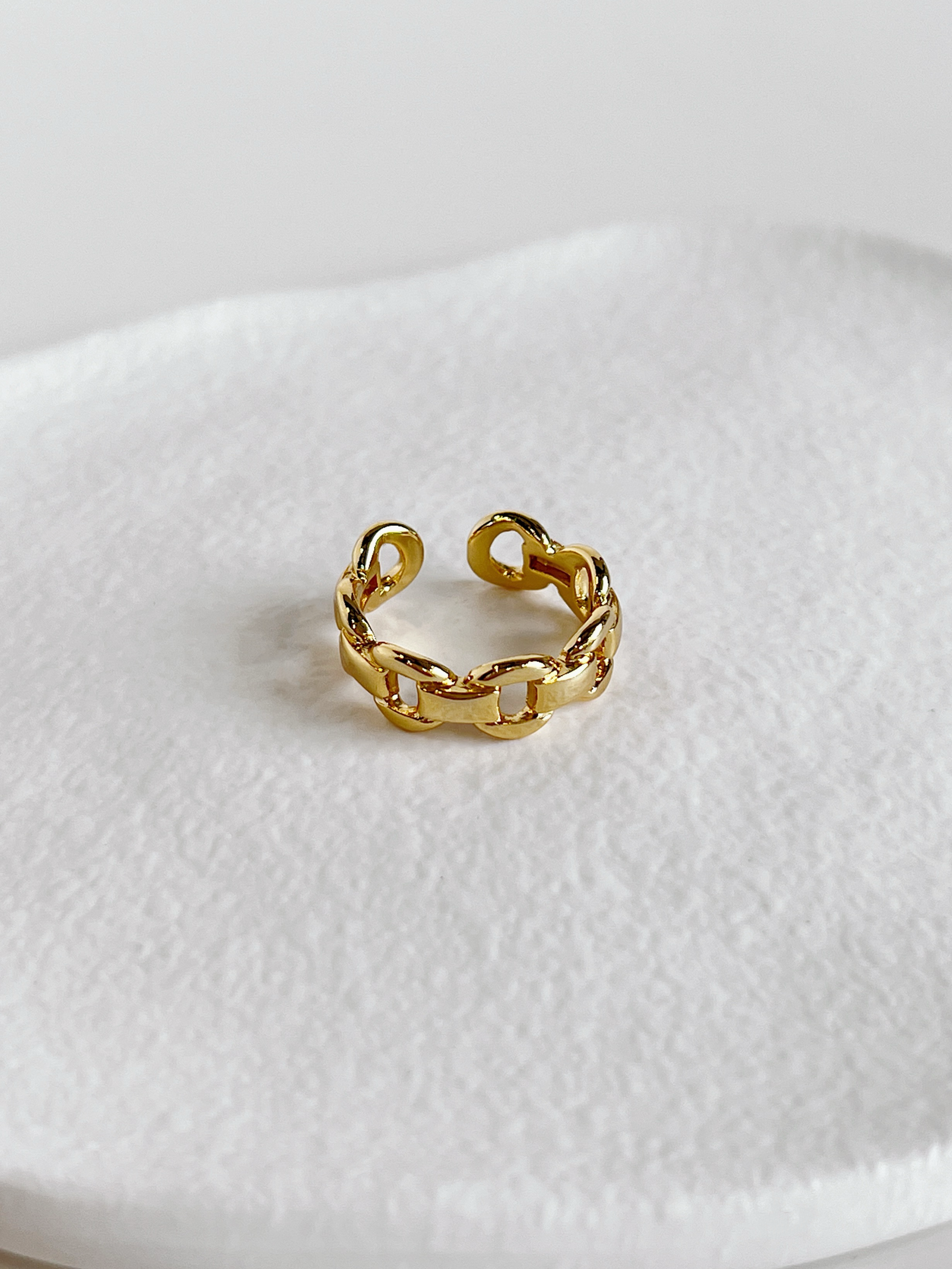 Chunky gold chain rings for women highlighting the adjustable open back