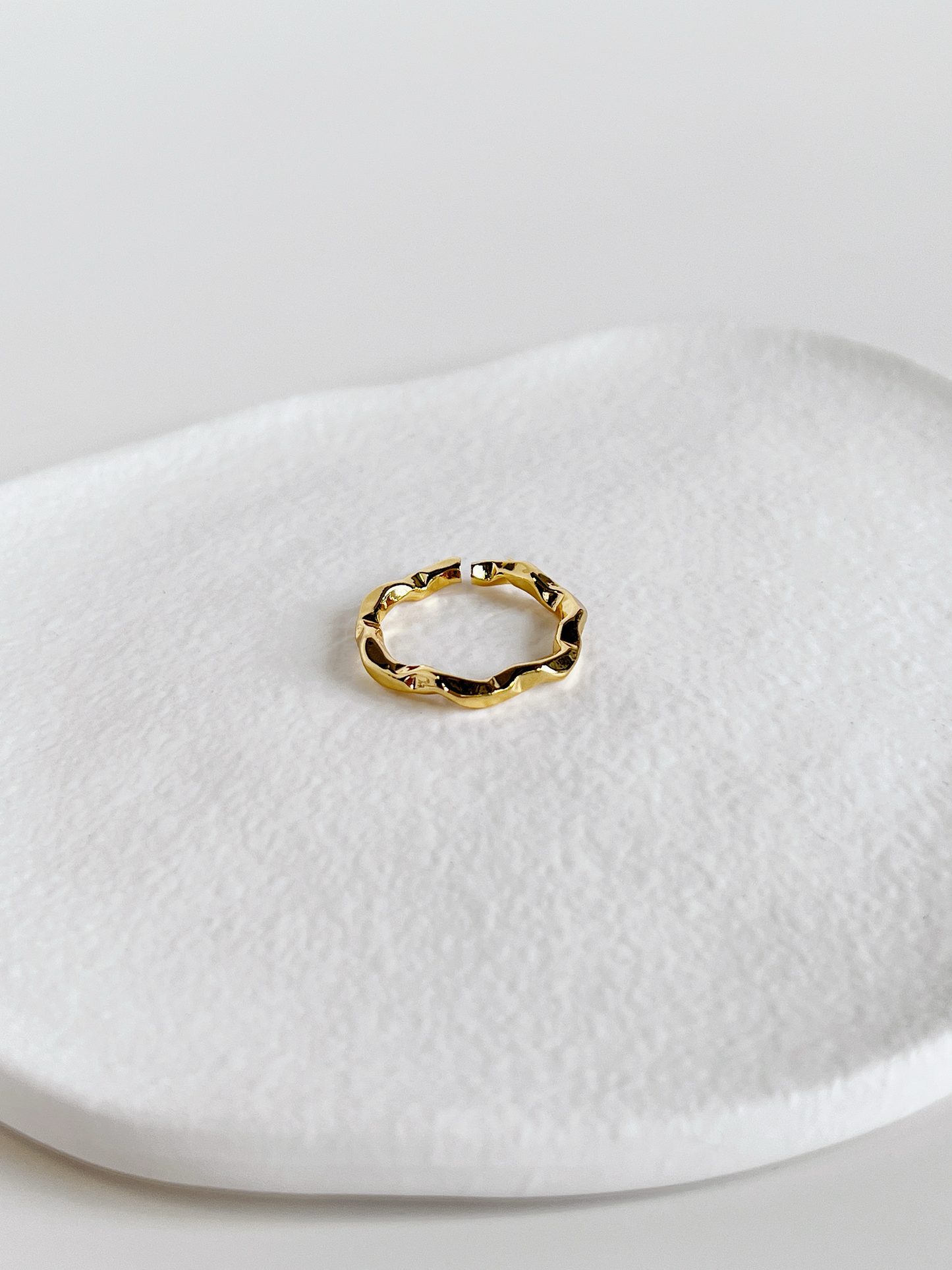 Tarnish-free 18k gold-plated everyday ring shown on soft display