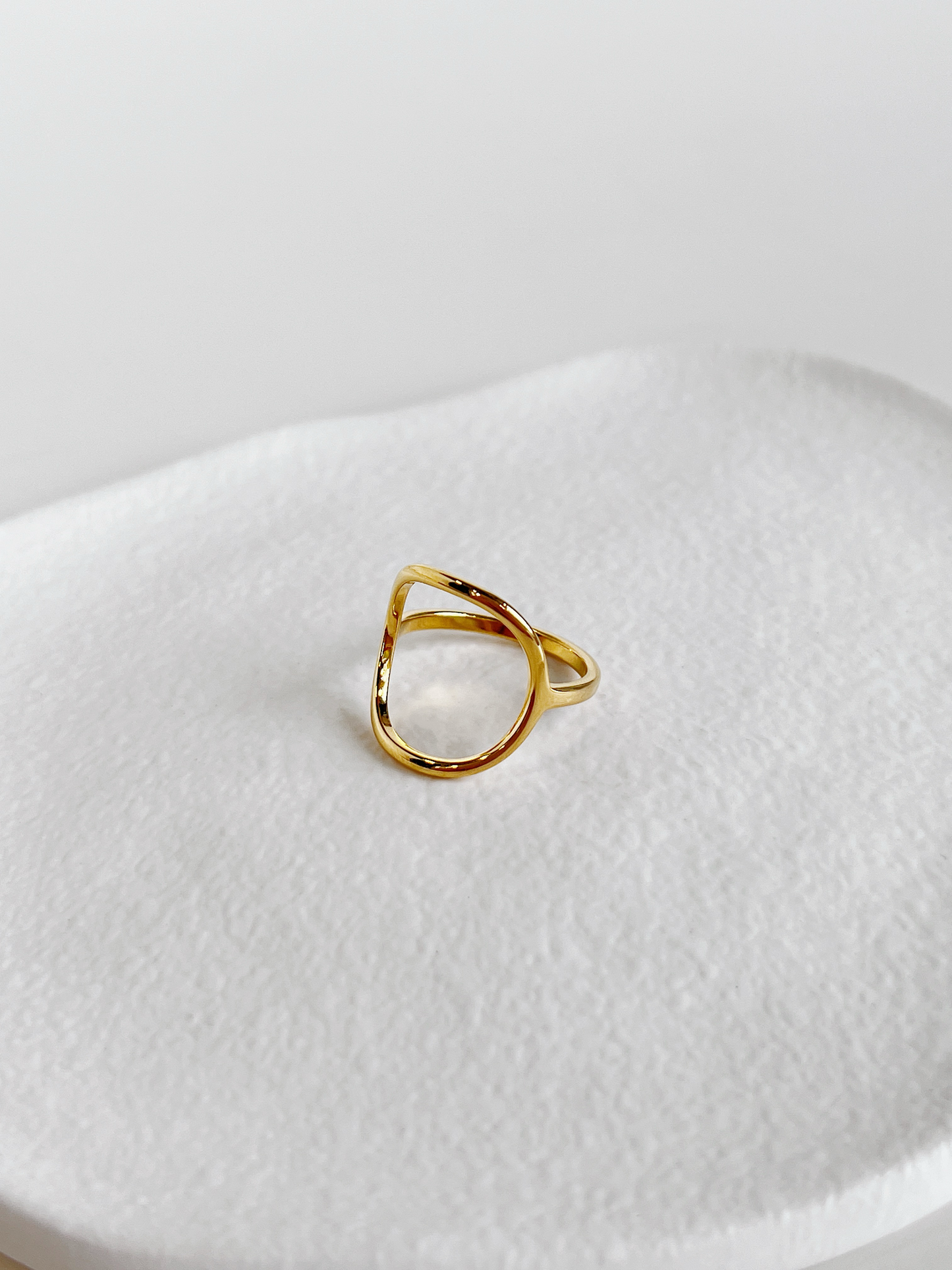 Tarnish-resistant 18k gold-plated brass everyday ring displayed on a white tray
