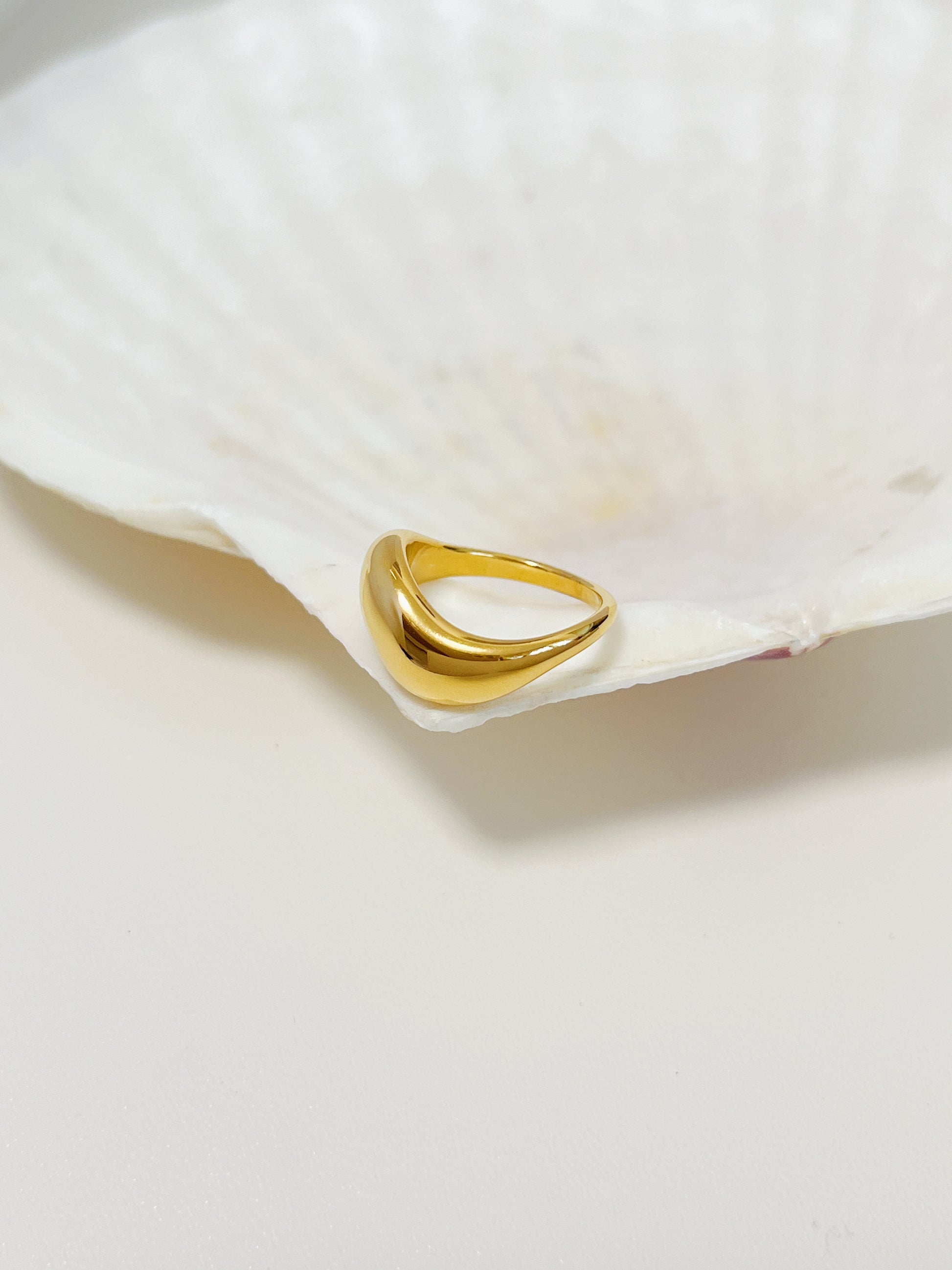 Tarnish-free 18k gold-plated stainless steel wave dome ring on white display