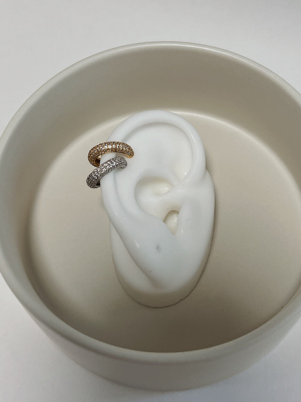 Ear stack styling with Anika gold 4-row cuff.