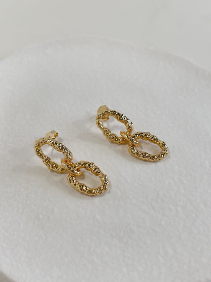 High refraction statement earrings with irregular cratered facets built for modern lookbook styling curation