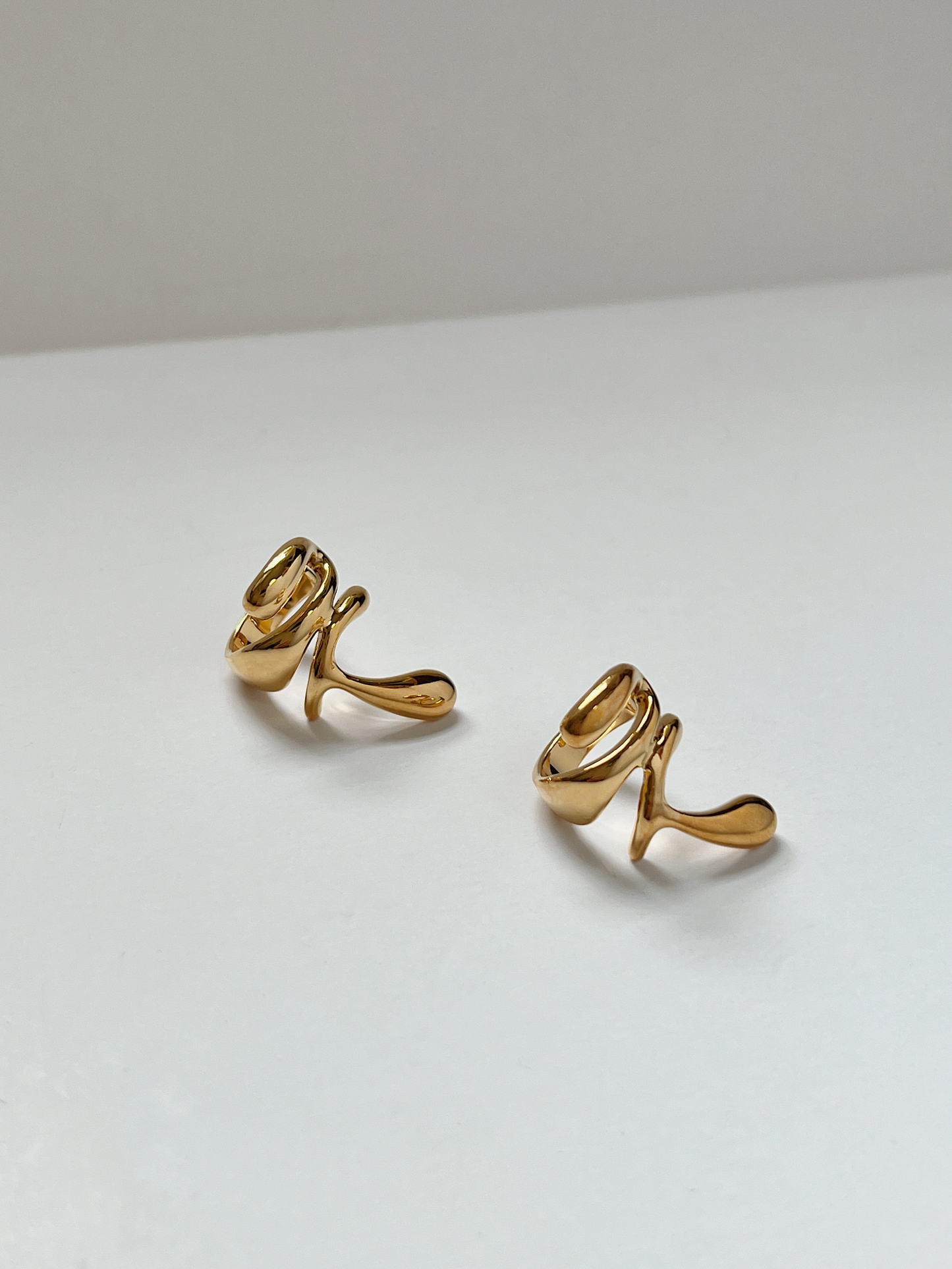 Abstract gold ear cuff, modern jewelry piece, unique design, perfect for women, Modern organic gold ear cuff worn on the cartilage.