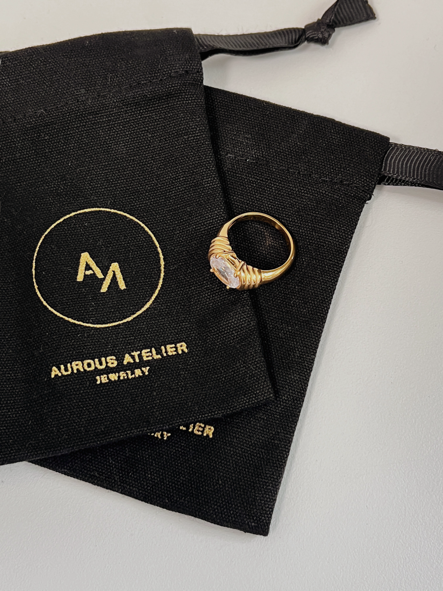 Chiara wide gold band featuring pave set 5A cubic zirconia stones
