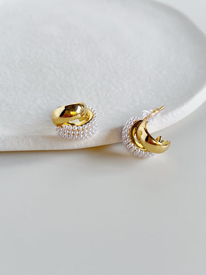 High polish yellow gold earring posts featuring comfortable secure plastic clutch backings