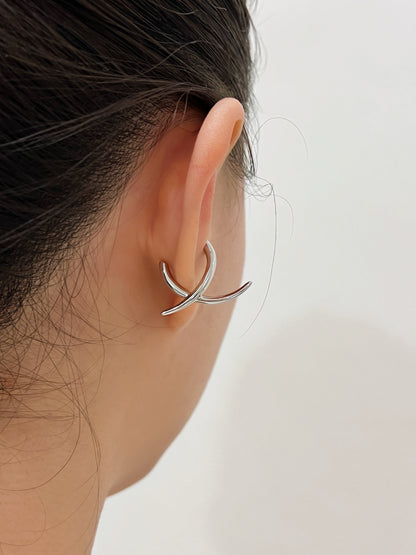 Back view of model wearing the Harley cuff to show how the "X" shape contours the ear.