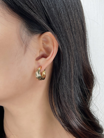 Side view highlighting comfortable fit of micro-adjustable screw-back clip on unpierced ear
