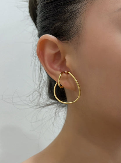Fashion-forward ear stack featuring the Kendra gold ear cuff.