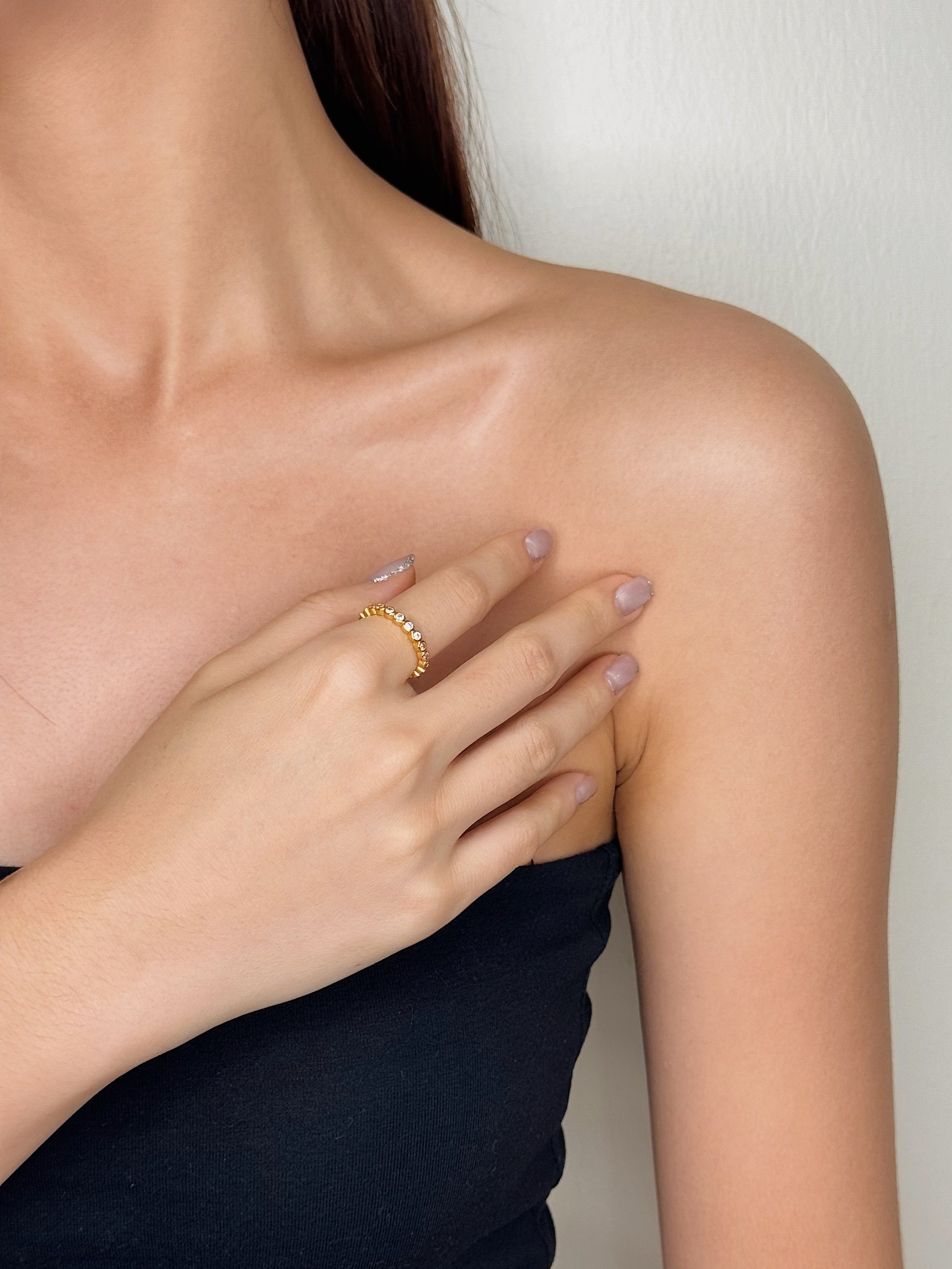 Modern jewelry styling with a delicate beaded gold ring for work in Canada