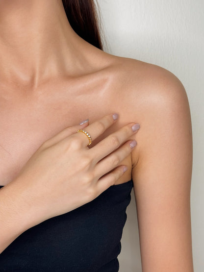 Modern jewelry styling with a delicate beaded gold ring for work in Canada