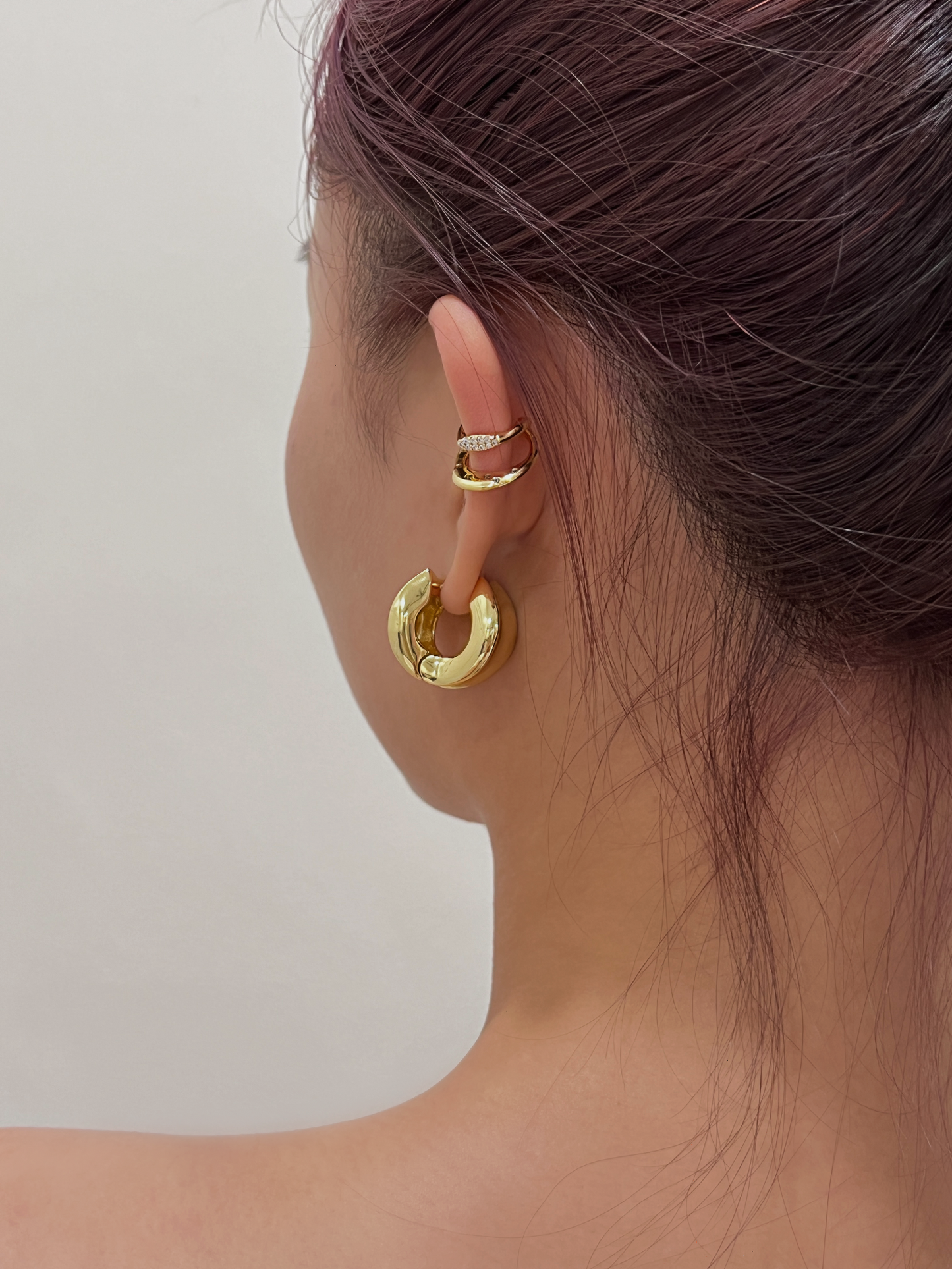 Close-up of Ashley Cuff sitting securely on model's ear cartilage.