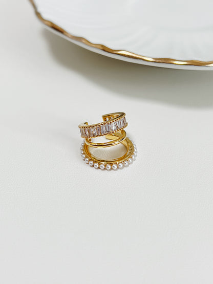 Close-up of Luxe Triple Ear Cuff featuring baguette CZ and pearls.