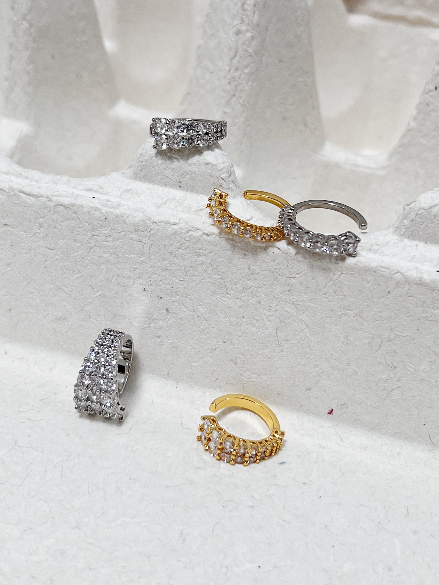 Close-up of the group of Emily Cuffs in 18k gold & Rhodium PVD with CZ stones
