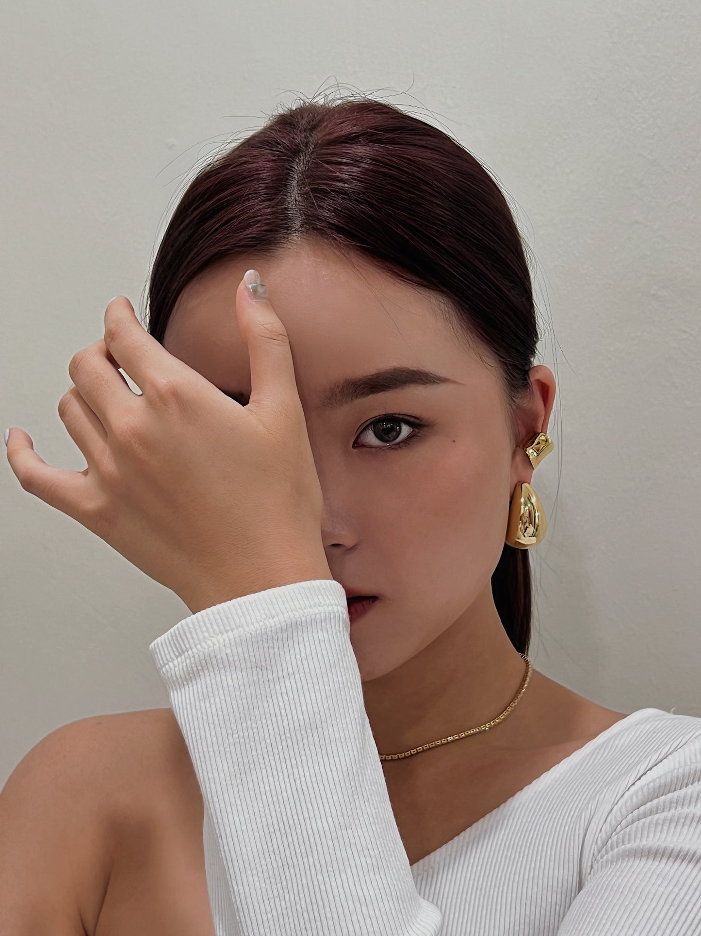 Ear stack inspiration featuring Kelly chunky gold cuff.