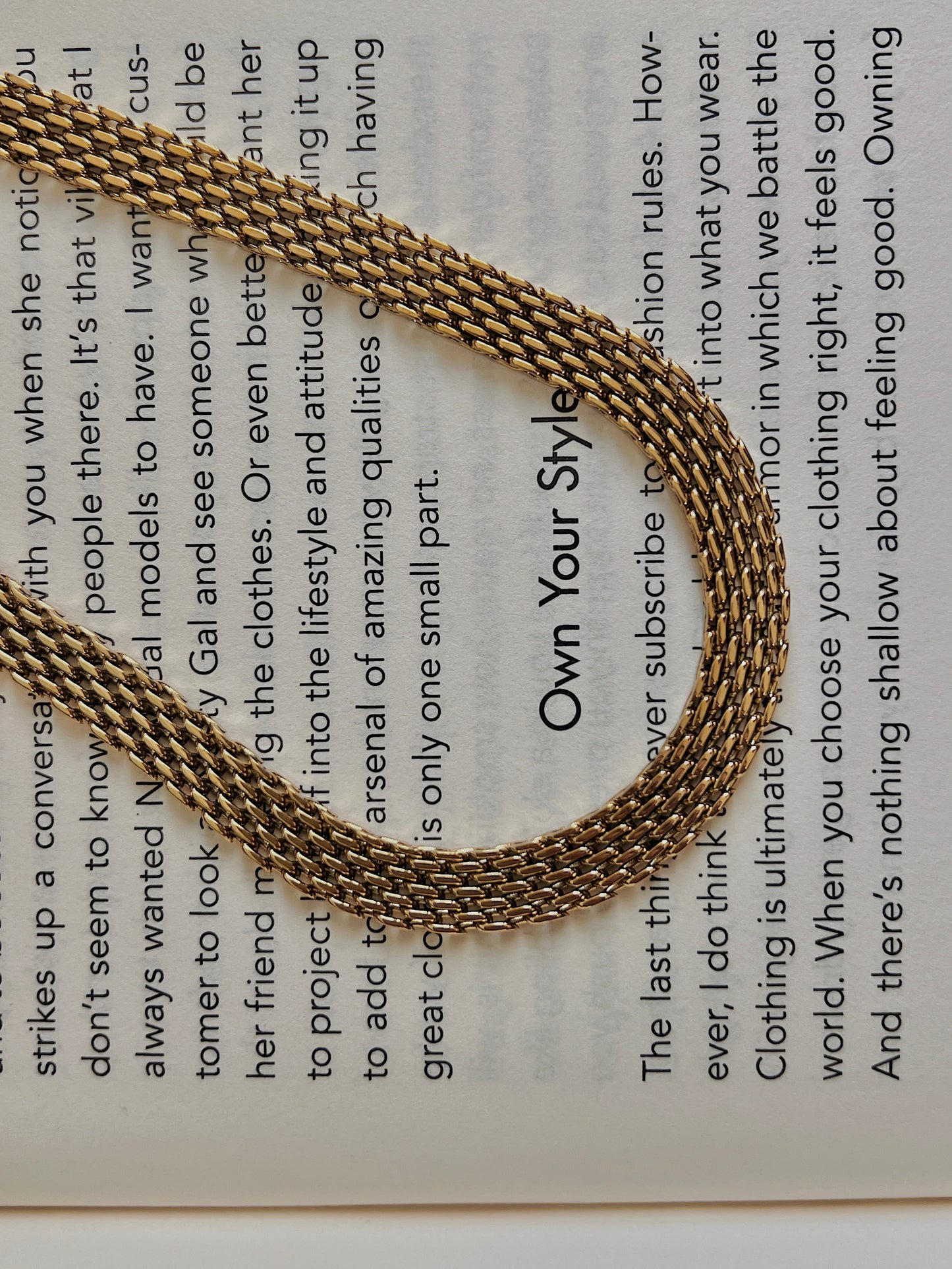 Luxury jewelry catalog presentation displaying the flat profile of a wide stainless steel base collar