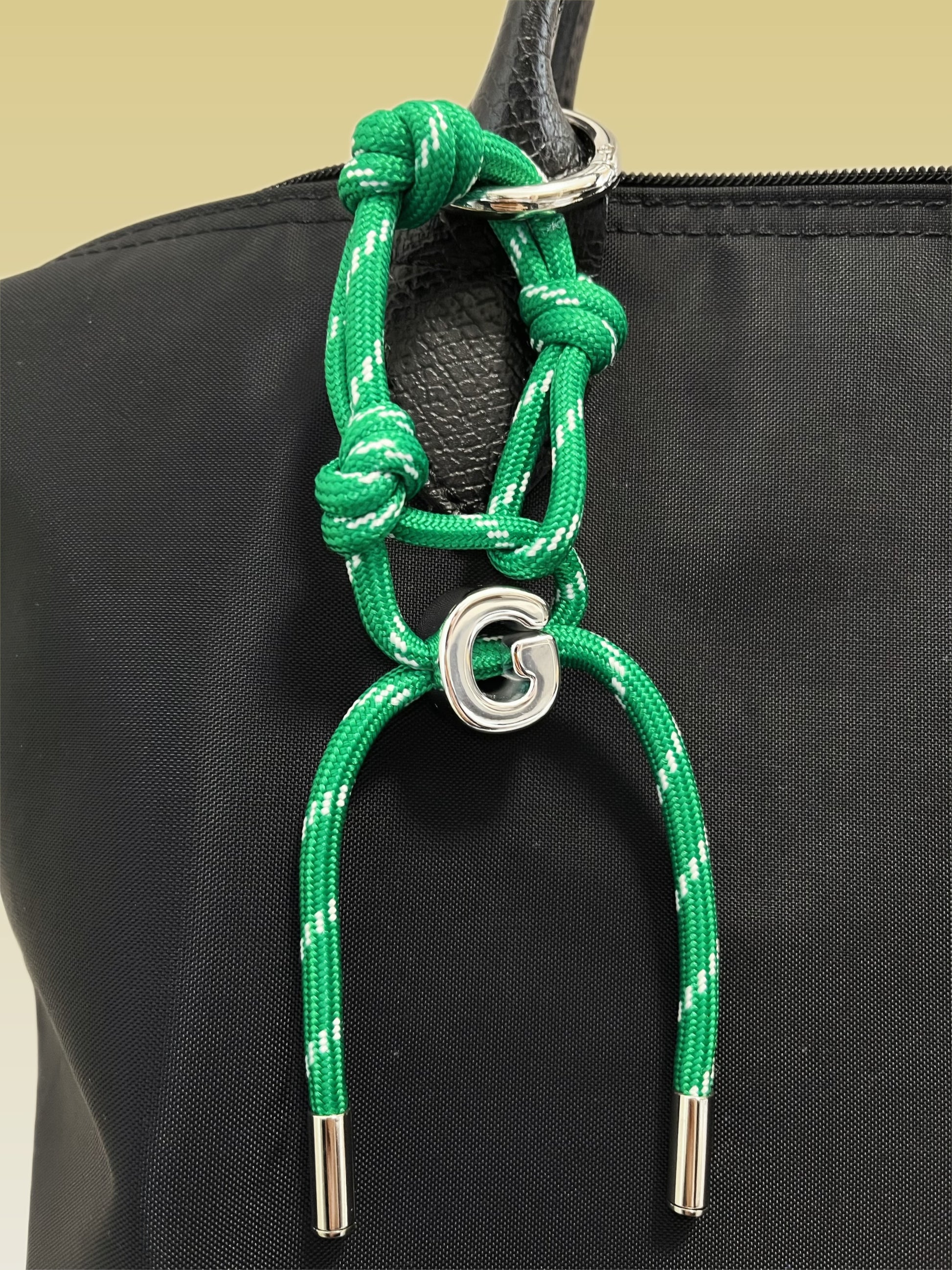 Aurous atelier jewelry grade custom letter hardware highlighting a thick dimensional initial block charm