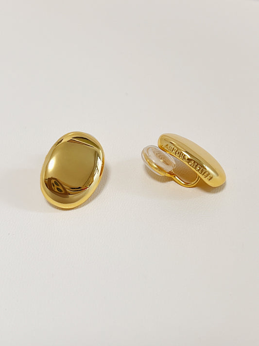 Pair of 18K gold plated Margaux bold oval clip-on earrings displaying high-polish mirror finish