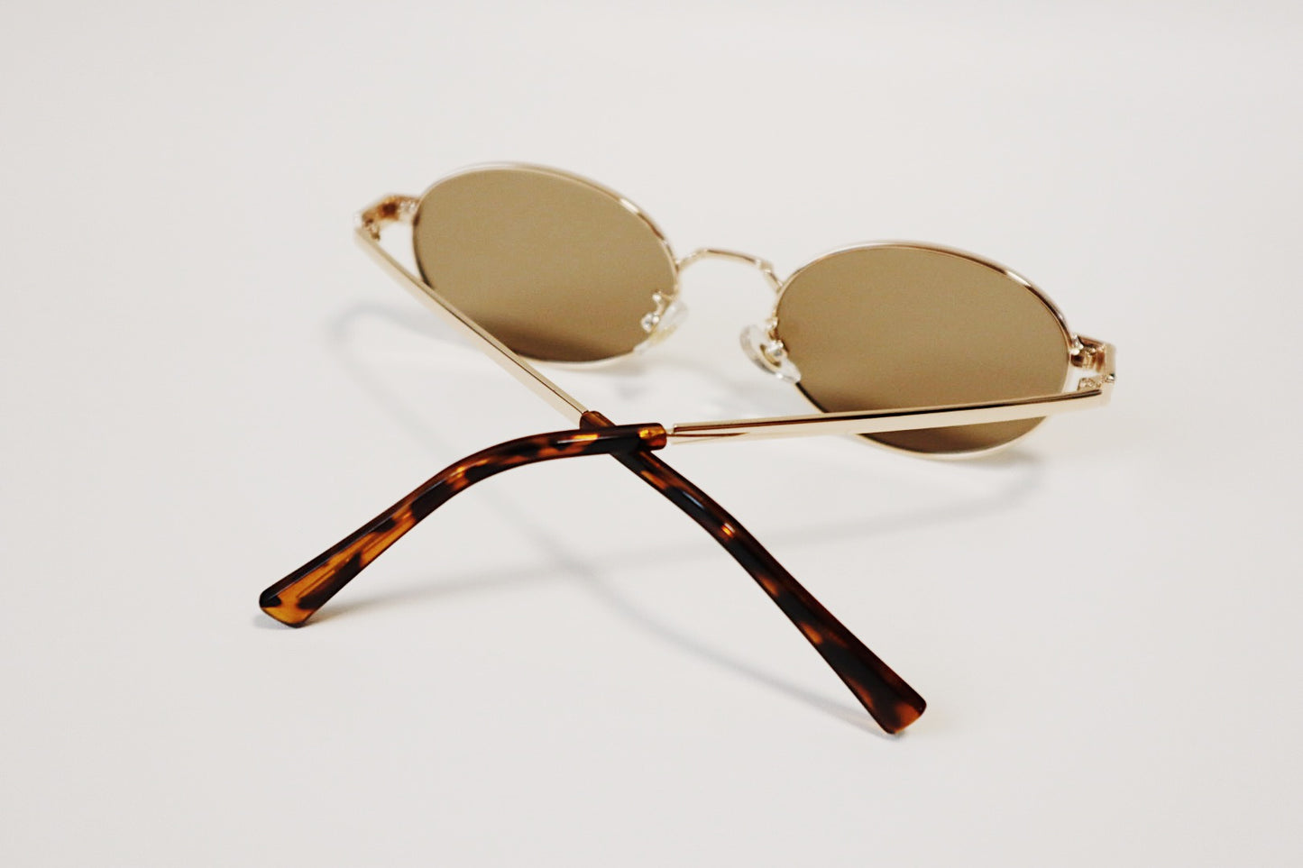 Macro view of the Marseille sunglasses showcasing the rich tortoiseshell acetate ear tips and the precision hinge construction.