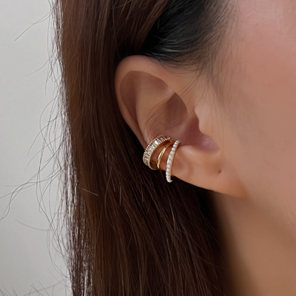 Close-up of model's ear showing the non-pierced triple cuff fit.