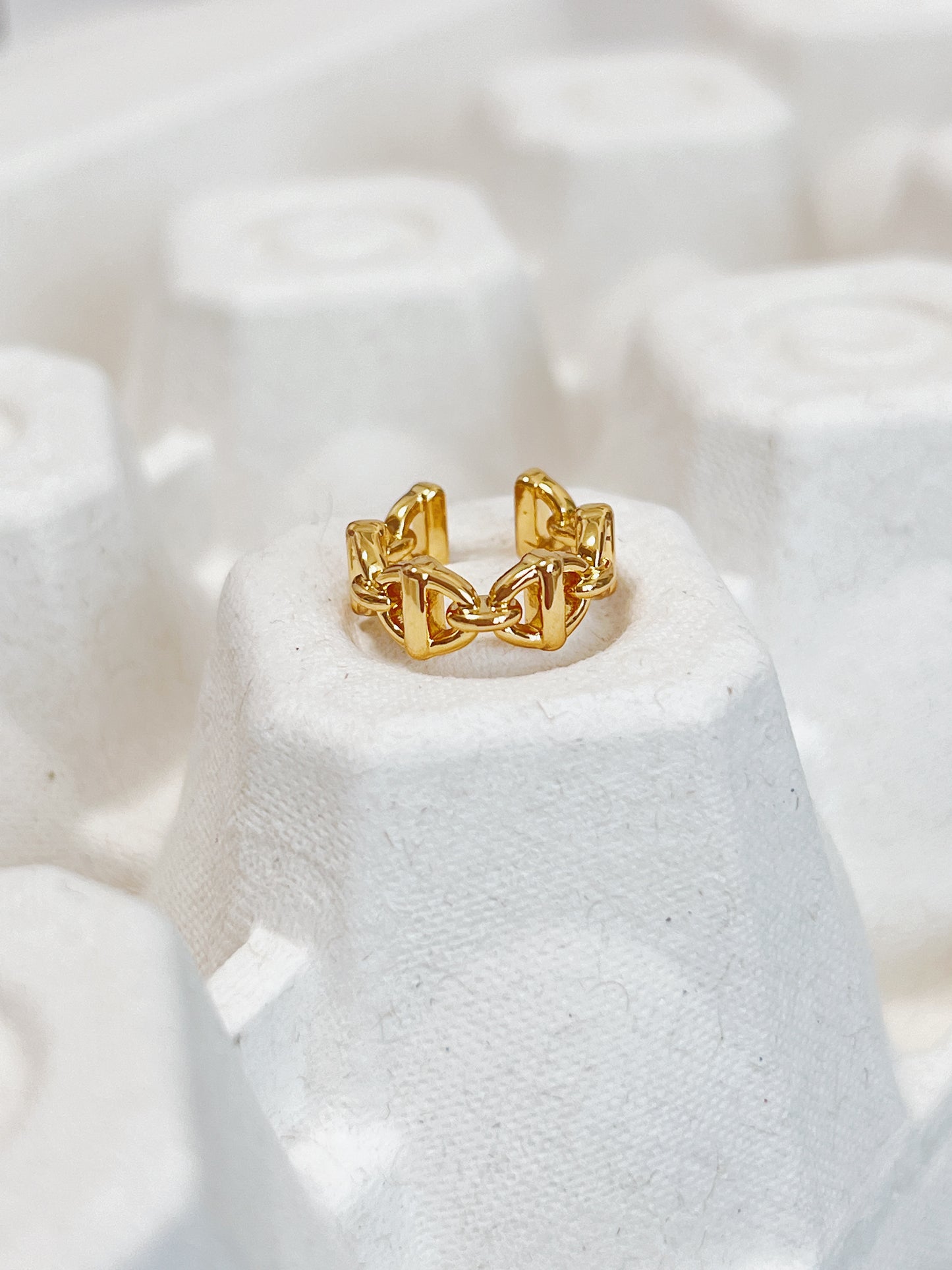 Detailed view of the PVD gold finish on the interior of the Windsor brass ear cuff.