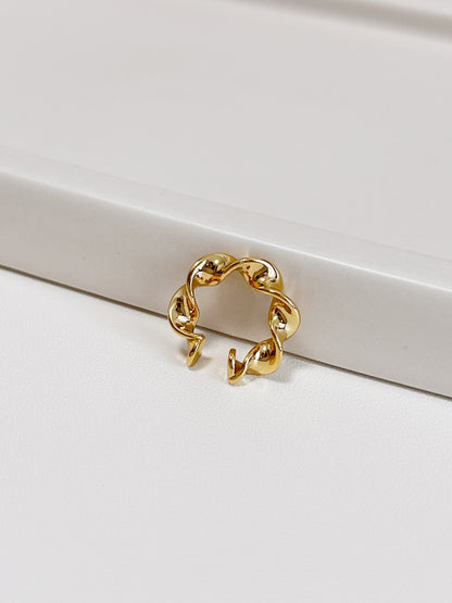 Architectural twist band design of Mindy gold cuff.