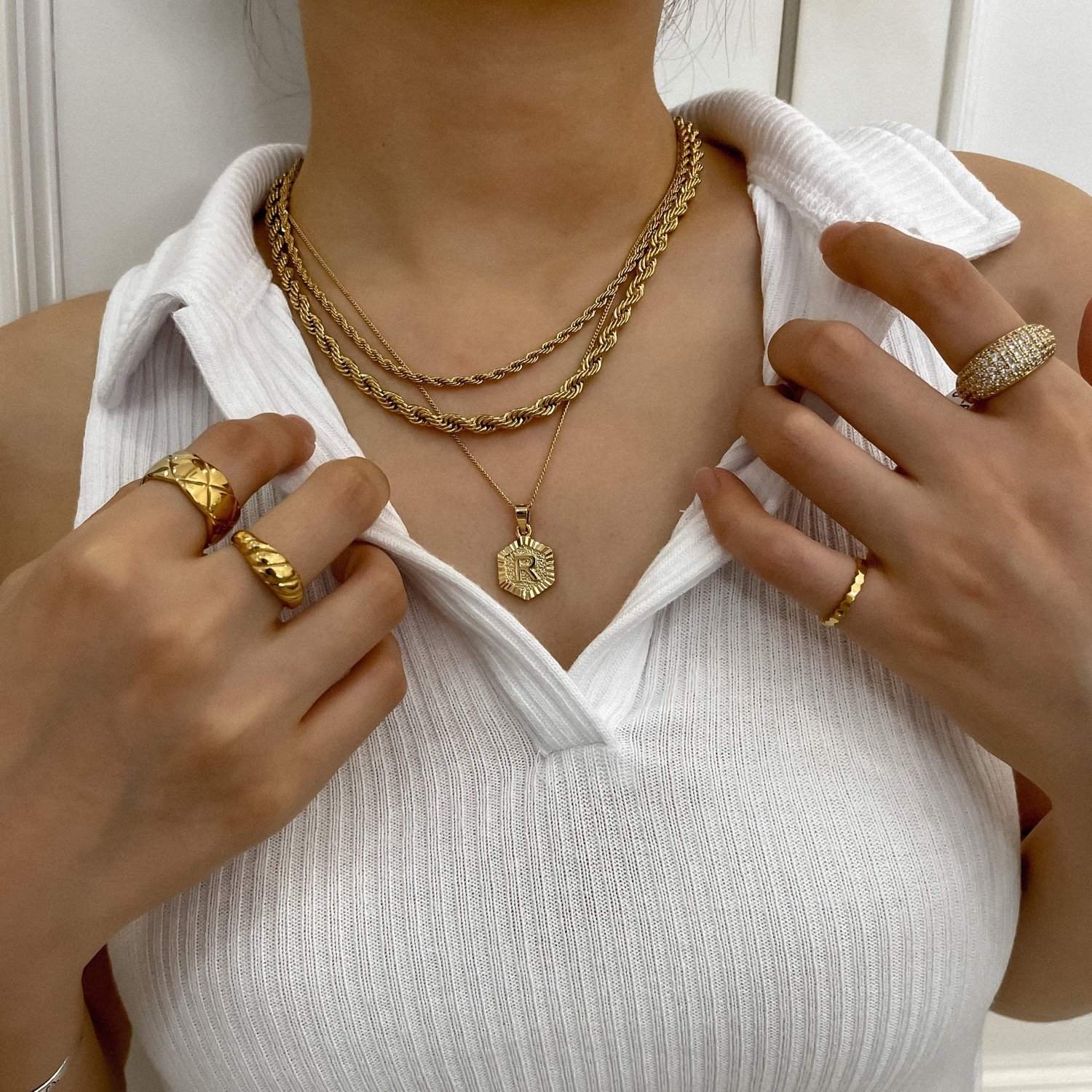 Lifestyle photography of gold jewellery styling for a basic white top