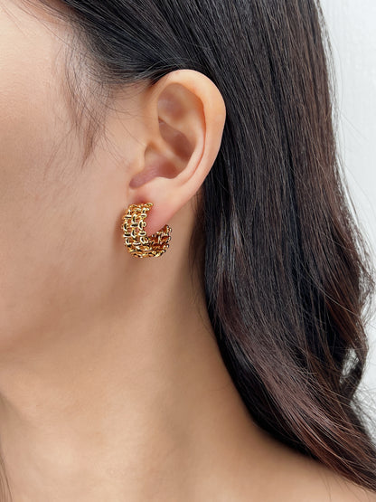 Side profile of Mylie hoops in an ear stack.