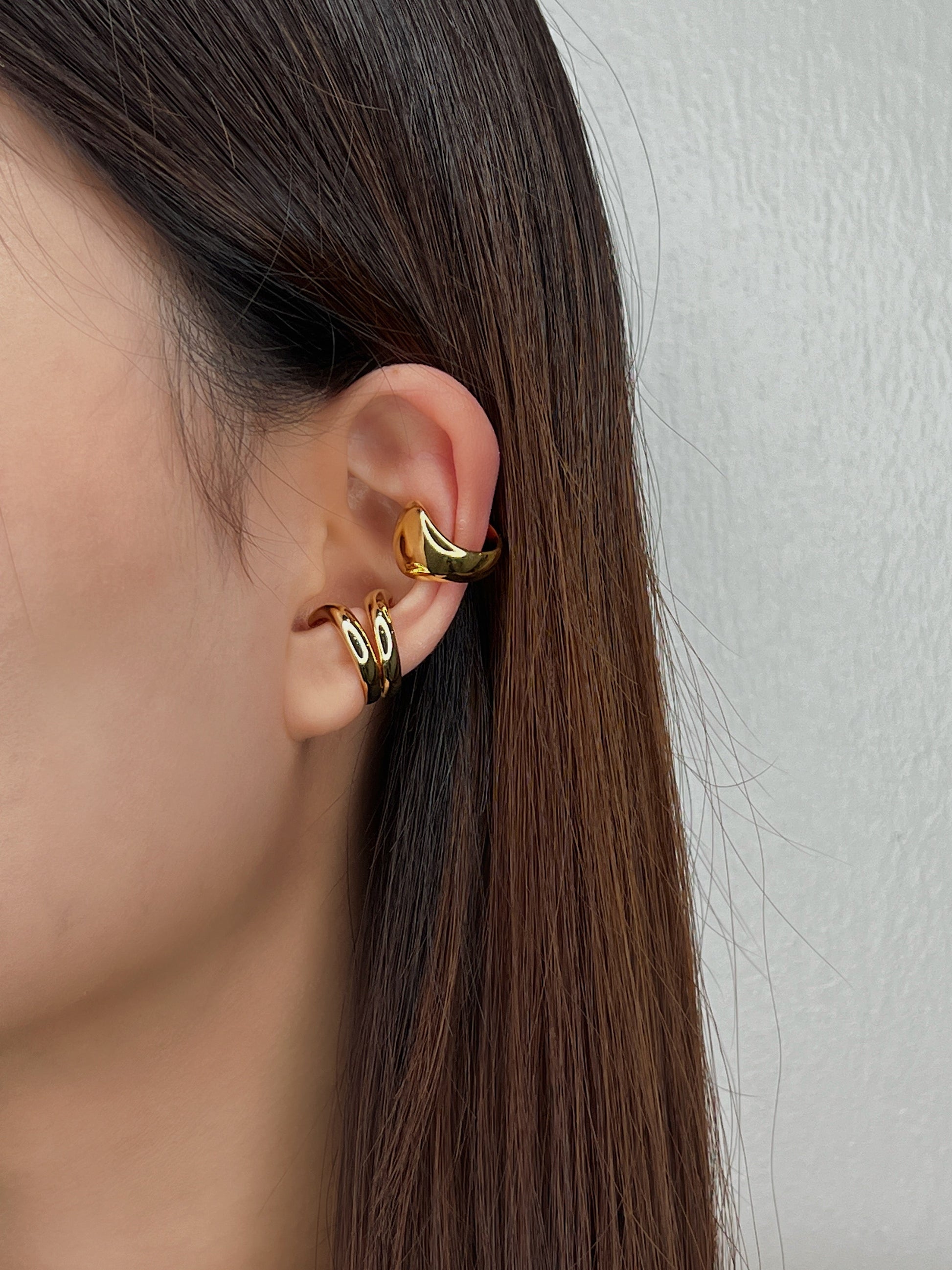 Model wearing Tobi abstract cuff on helix.