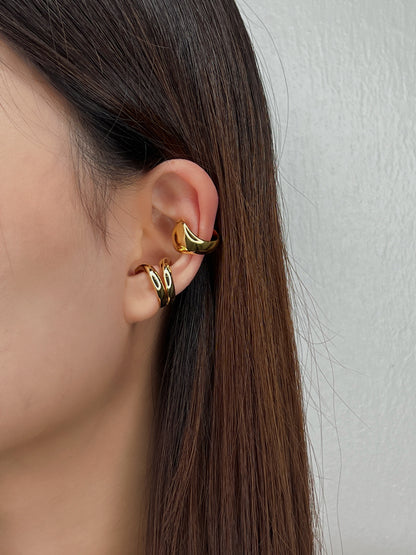 Model wearing Tobi abstract cuff on helix.