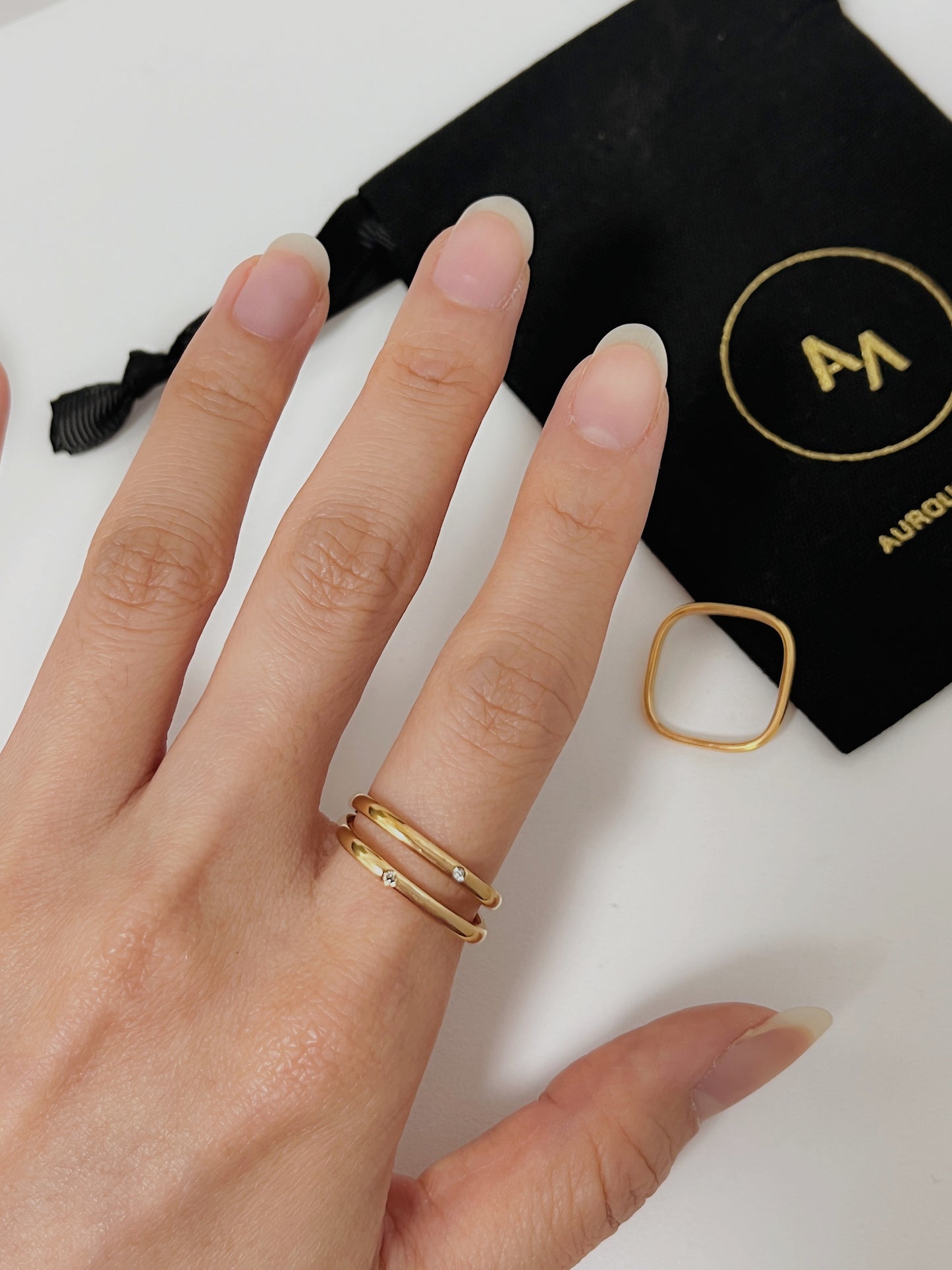 Model wearing the Ivy square ring on her index finger for a quiet luxury look