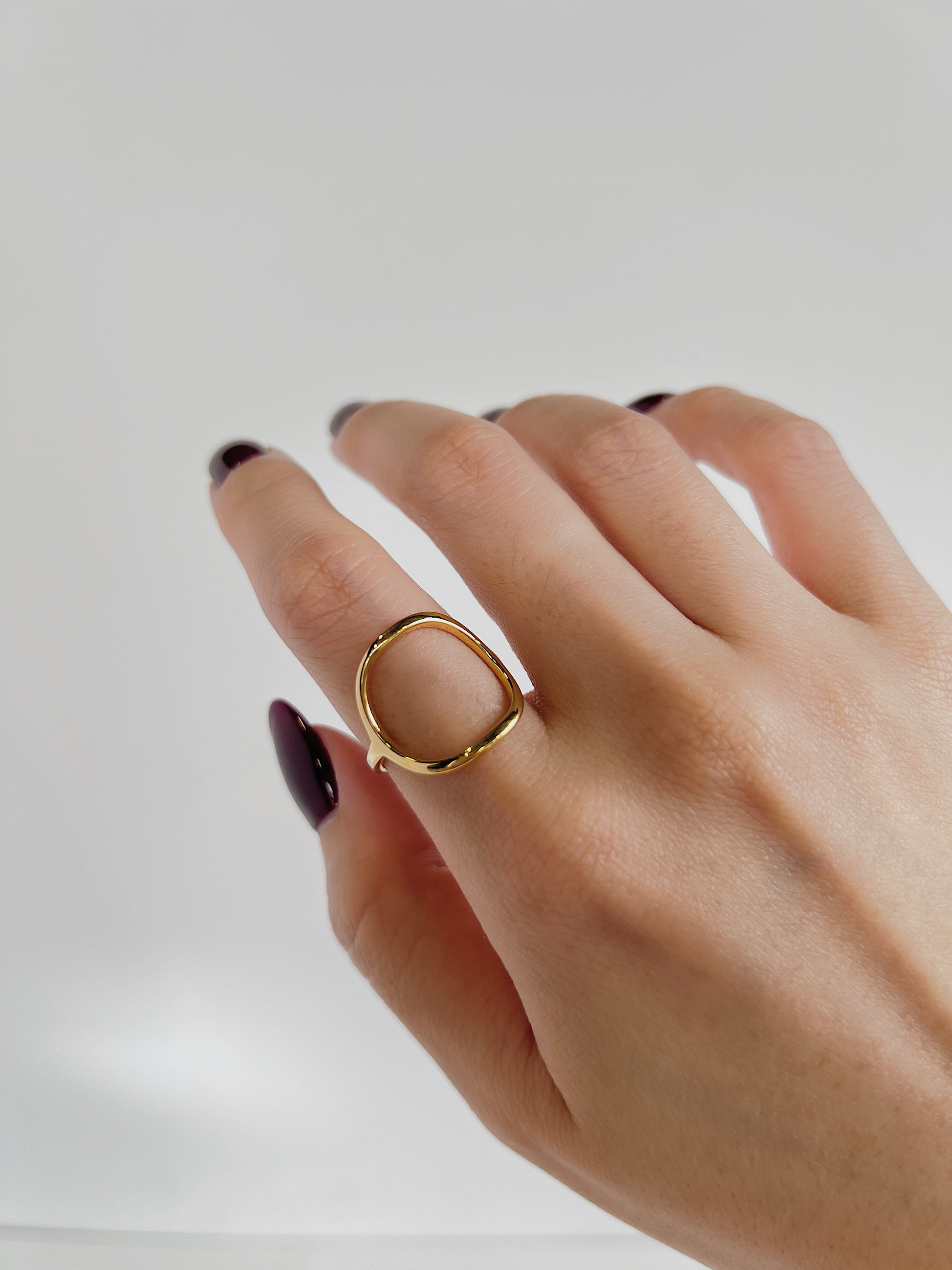 Model wearing the slim Leah Minimalist Ring on her index finger