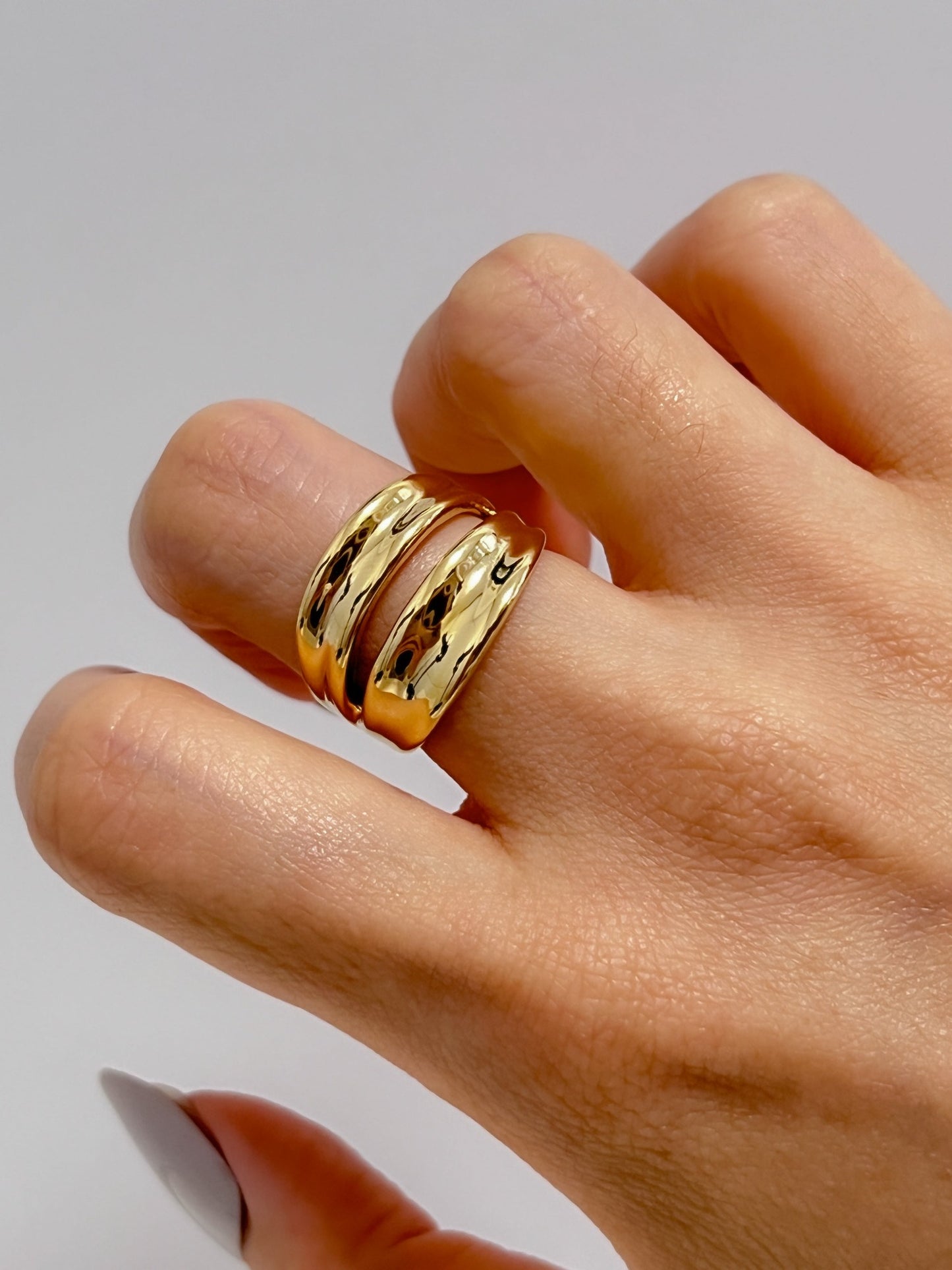 Model wearing the Renee double band ring on her middle finger for a quiet luxury look