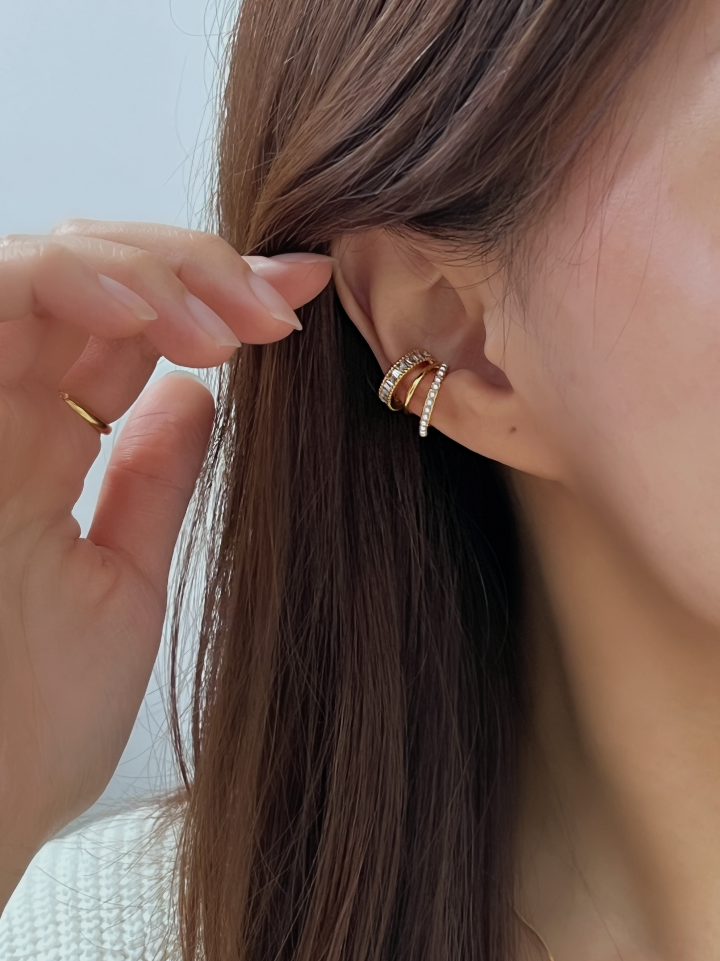 Model wearing Luxe Triple Ear Cuff at the mid-helix.