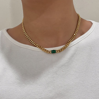 Model collarbone view styling elegant green rectangle pendant necklace over white ribbed top