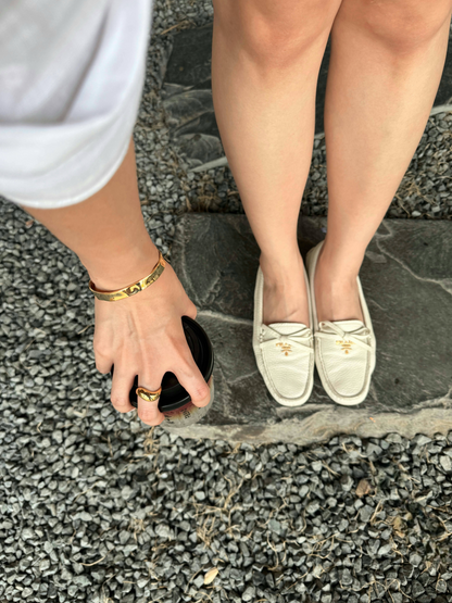 Minimalist right-hand ring styling featuring a bold gold ring on model