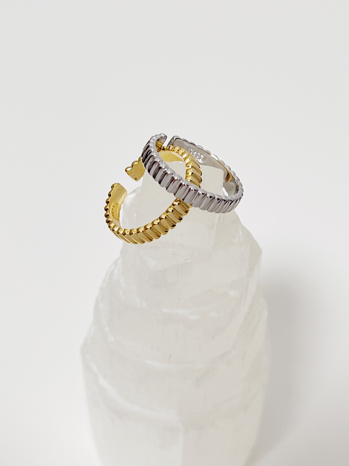 Close up of modern low profile open back 4mm ribbed ring made from recycled silver