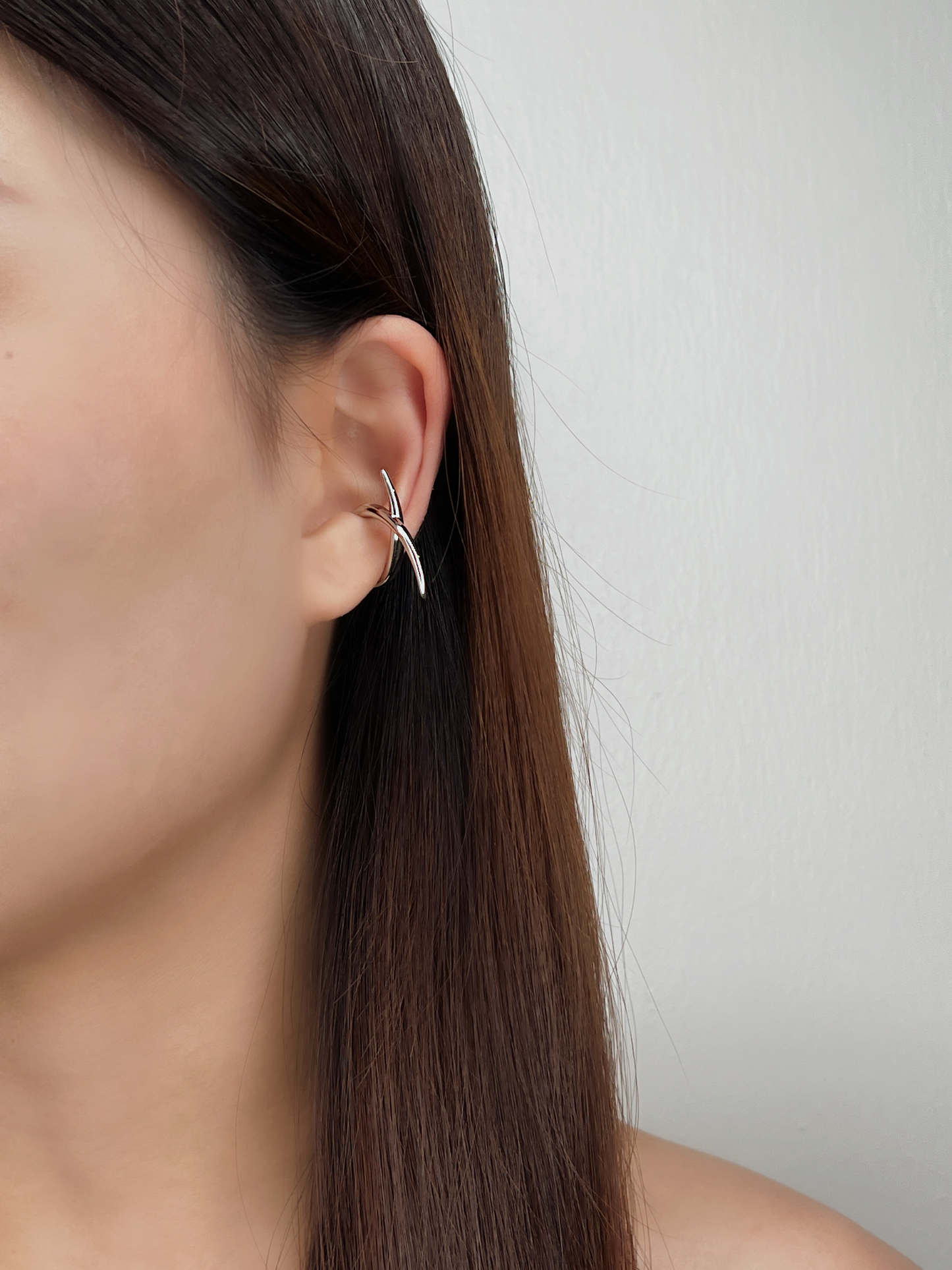 Model styling the Harley cuff with a slicked-back hairstyle to showcase the geometric lines.