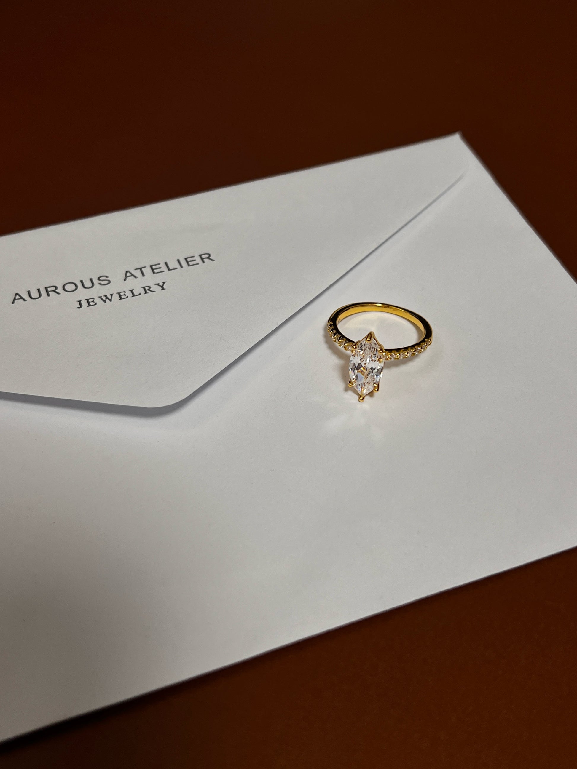 Low-light evening sparkle of the Kinn moissanite ring.